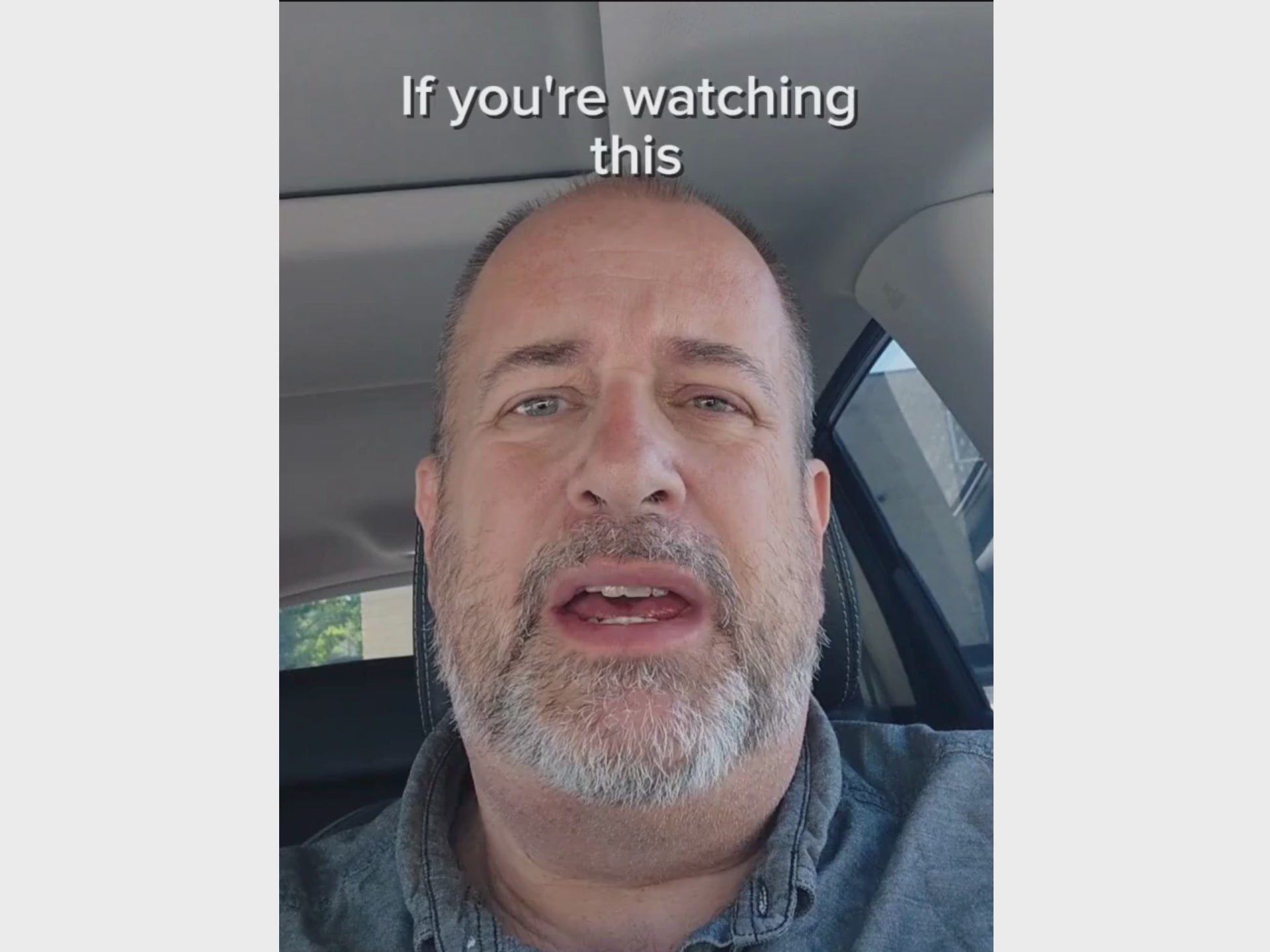 Man in blue shirt talking to camera about Nurses Escape Kit